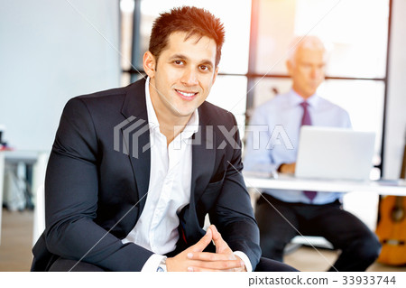Businessman at the office Businessman at the office 33933744