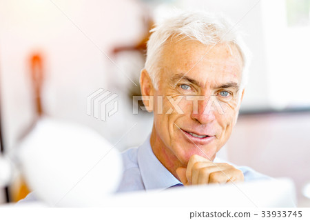 Businessman at the office Businessman at the office 33933745