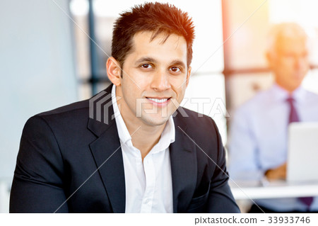 Businessman at the office Businessman at the office 33933746