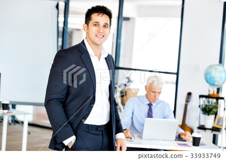 Businessman at the office Businessman at the office 33933749
