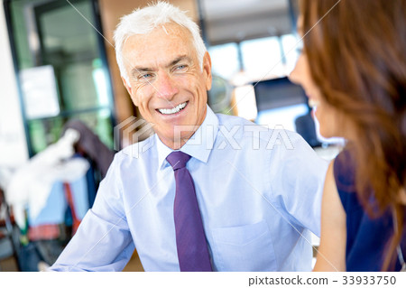 Businessman at the office Businessman at the office 33933750