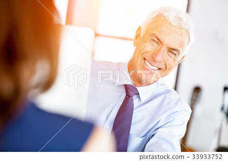 Businessman at the office Businessman at the office 33933752