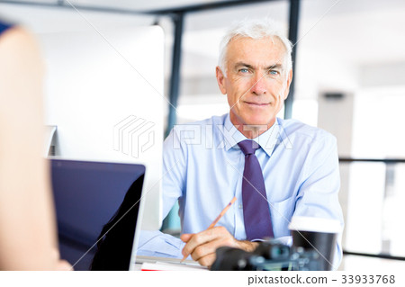 Businessman at the office Businessman at the office 33933768