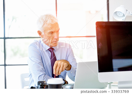 Businessman at the office Businessman at the office 33933769