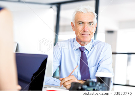 Businessman at the office Businessman at the office 33933770