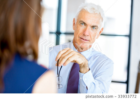 Businessman at the office Businessman at the office 33933772