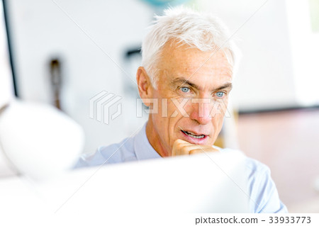 Businessman at the office Businessman at the office 33933773
