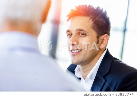 Businessman at the office Businessman at the office 33933774