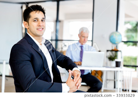 Businessman at the office Businessman at the office 33933829