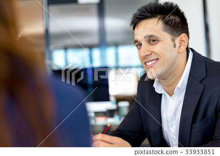 Businessman at the office Businessman at the office 33933851