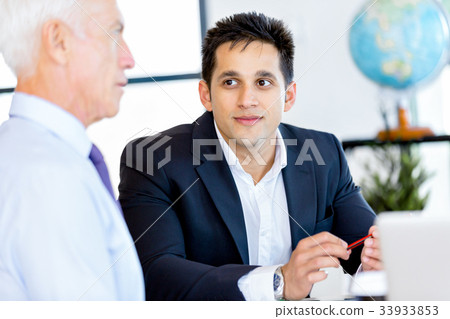 Businessman at the office Businessman at the office 33933853