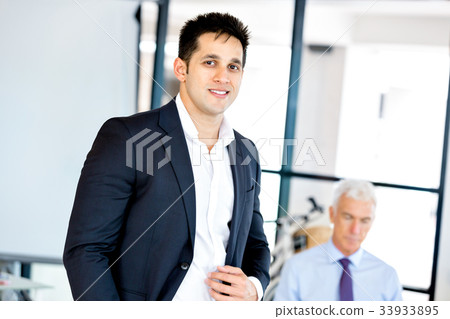 Businessman at the office Businessman at the office 33933895