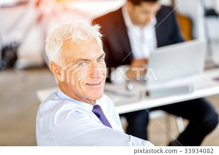 Businessman at the office Businessman at the office 33934082