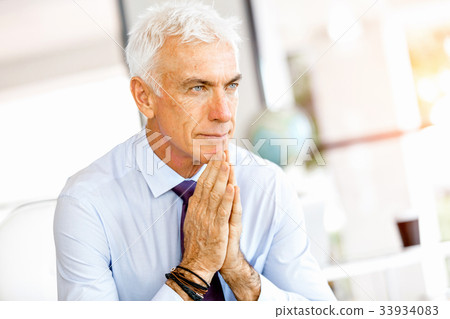 Businessman at the office Businessman at the office 33934083