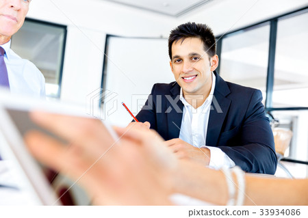 Businessman at the office Businessman at the office 33934086