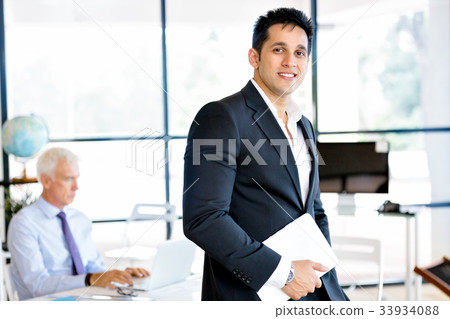Businessman at the office Businessman at the office 33934088