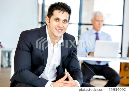 Businessman at the office Businessman at the office 33934092