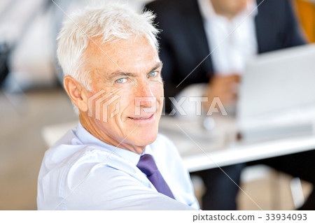 Businessman at the office Businessman at the office 33934093