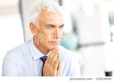Businessman at the office Businessman at the office 33934094