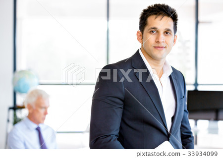 Businessman at the office Businessman at the office 33934099