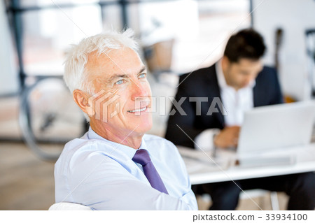 Businessman at the office Businessman at the office 33934100