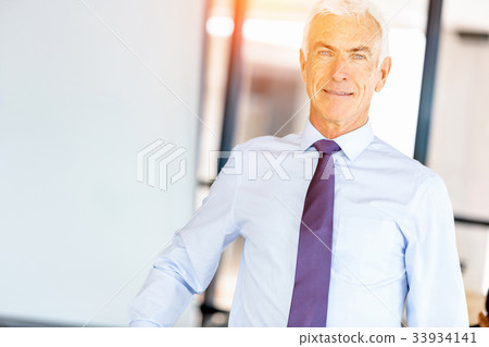 Businessman at the office Businessman at the office 33934141