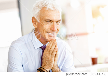 Businessman at the office Businessman at the office 33934142
