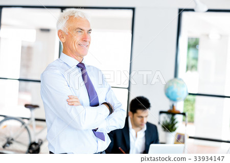 Businessman at the office Businessman at the office 33934147