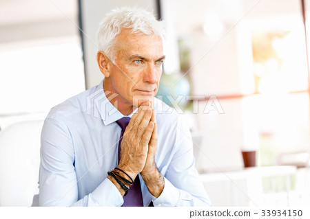 Businessman at the office Businessman at the office 33934150