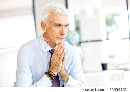Businessman at the office Businessman at the office 33934162