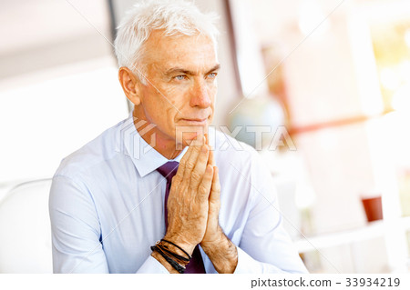 Businessman at the office Businessman at the office 33934219