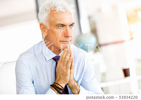Businessman at the office Businessman at the office 33934220