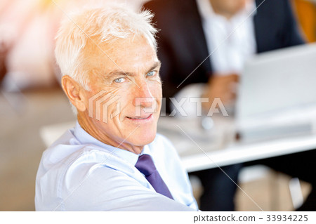 Businessman at the office Businessman at the office 33934225