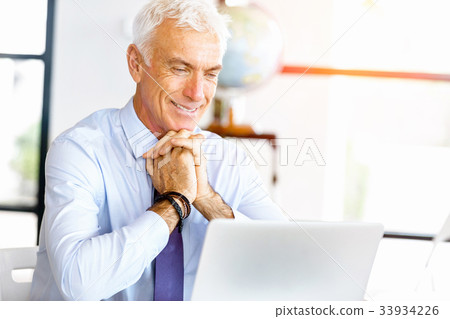 Businessman at the office Businessman at the office 33934226