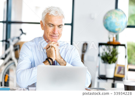Businessman at the office Businessman at the office 33934228