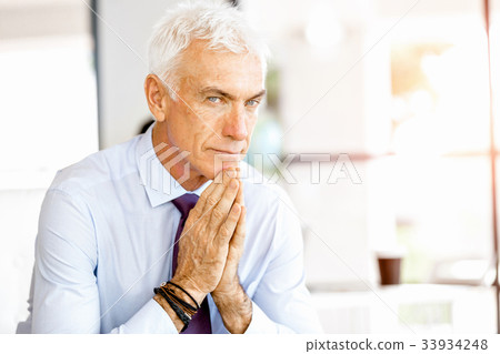 Businessman at the office Businessman at the office 33934248