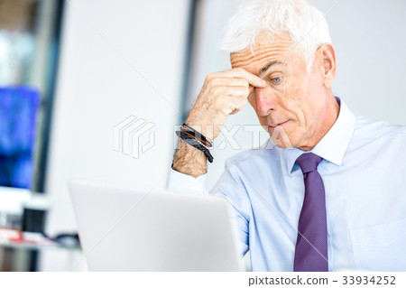 Businessman at the office tired Businessman at the office tired 33934252