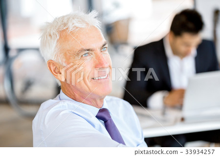 Businessman at the office Businessman at the office 33934257
