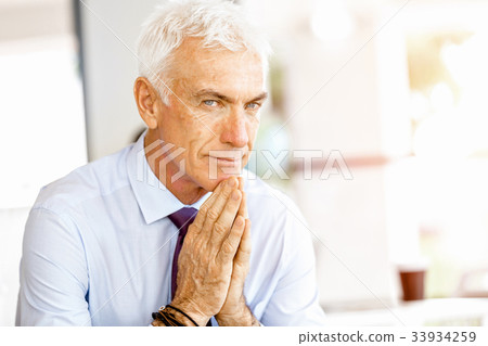 Businessman at the office Businessman at the office 33934259