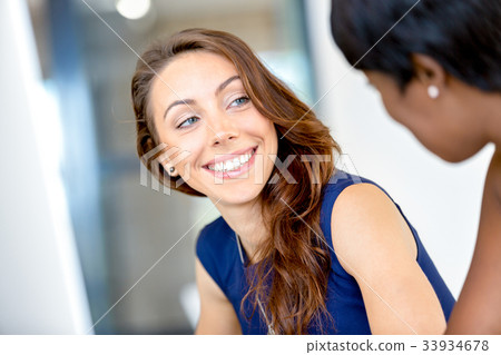 Women working together, office interior Women working together, office interior 33934678