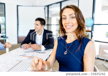 Young woman in office using tablet 33935242