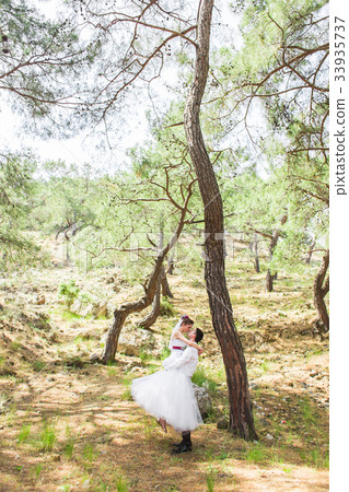 Portrait of happy bride and groom outdoor in 33935737