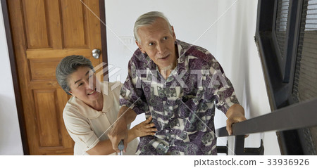 two people are holding hands and walking in nature 33936926