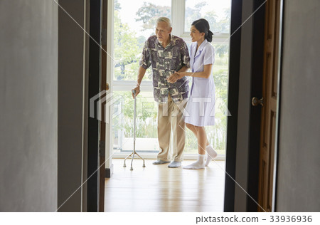 smiling old couple is driving in their car 33936936