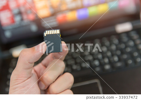 SD card with laptop computer background 33937472