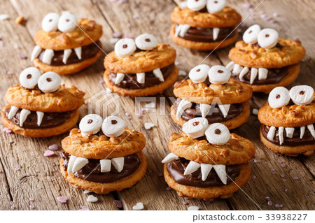 Toothed monsters of cookies close-up for Halloween Toothed monsters of cookies close-up for Halloween 33938227