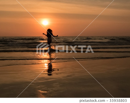 silhouette woman on the beach silhouette woman on the beach 33938803