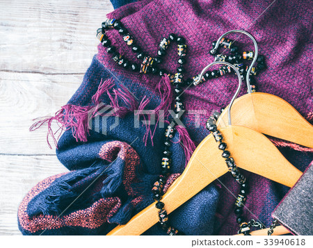 Wooden clothes hangers. Winter woman accessories Wooden clothes hangers. Winter woman accessories 33940618