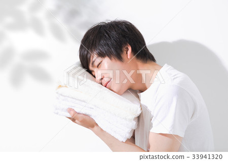 Towel and young man outdoor 33941320
