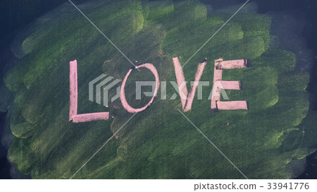 love word by chalk pastels on a blackboard. love word by chalk pastels on a blackboard. 33941776